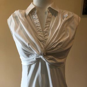 Sleeveless white blouse ruffled in the front